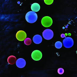 fluorescently colored spheres in shades of blue and green