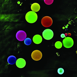 fluorescently colored spheres on a mottled background